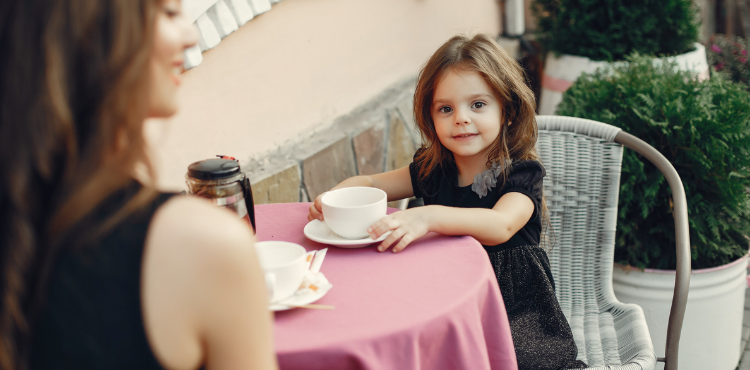 cute little girl coffee time with mother