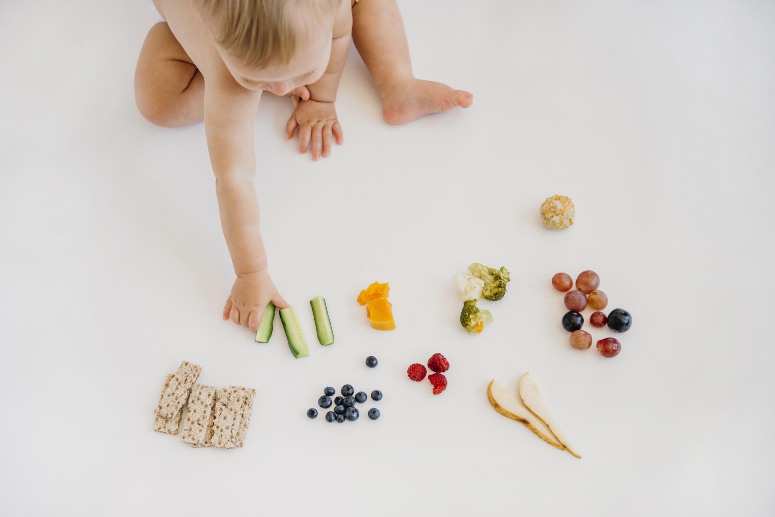 baby choosing what to eat alone
