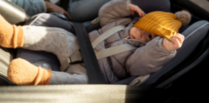 young baby in car seat